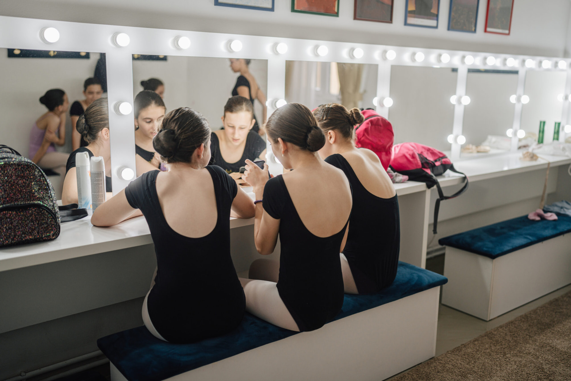 Dancers preparing together in a studio dressing room